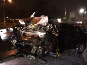 Wrecked cars after a nighttime multi-vehicle collision