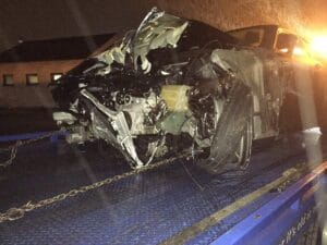 Heavily damaged SUV front end after a collision