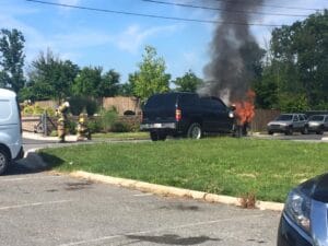Vehicle fire with firefighters on scene before accident recovery