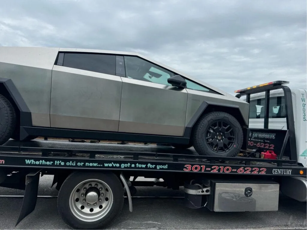 past present towing tesla truck